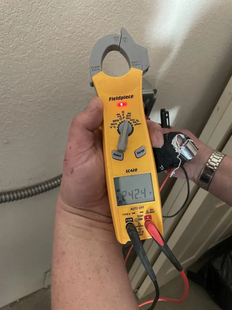 Voltage testing with clamp meter during Generator Installation in Golden Valley